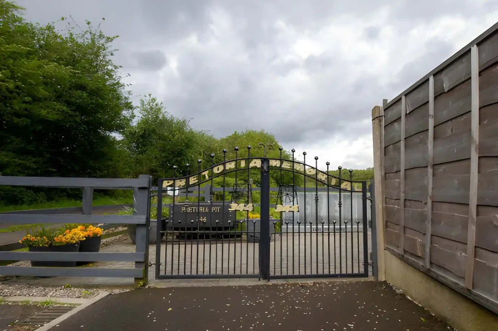 Wrought iron gates to the Pretorian Memorial, marking the historic mine site in Hulton.